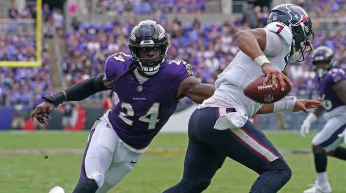 Ravens edge rusher Jadeveon Clowney pursues Texans QB C.J. Stroud in the backfield